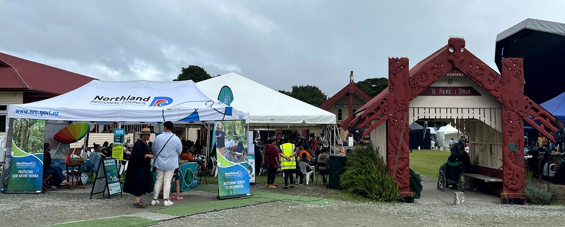 Gazebo and people outside gateway to marae.